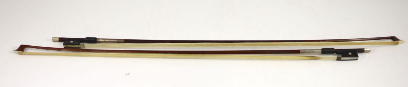 Two stamped violin bows,the first nickel mounted and stamped ‘Dodd’, the second silver mounted and