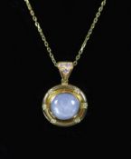 A 20th century French 18ct gold, cabochon star sapphire and diamond set circular pendant, on an 18ct