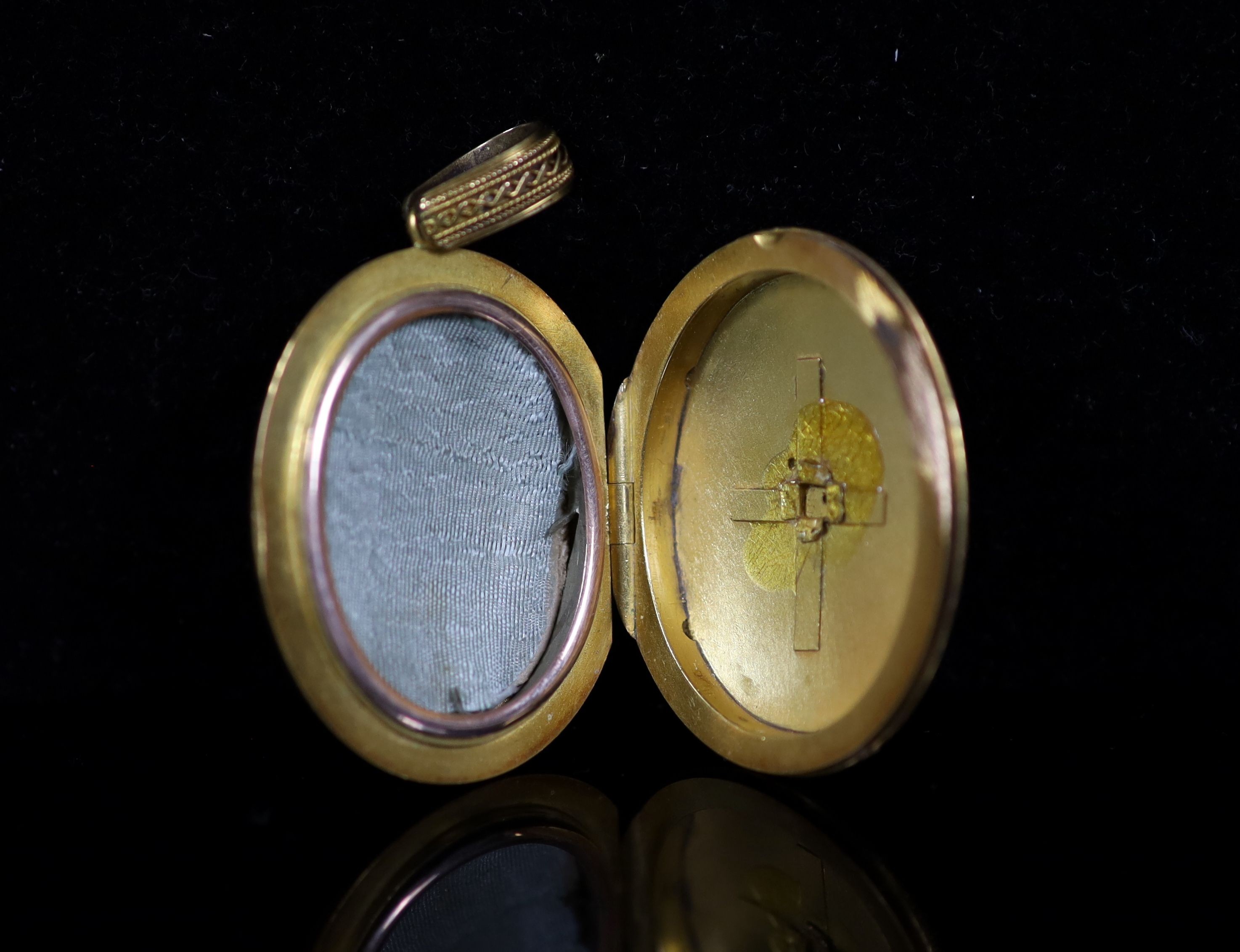 A Victorian gold and three stone turquoise set oval locket,with cannetille style border decoration - Image 2 of 3