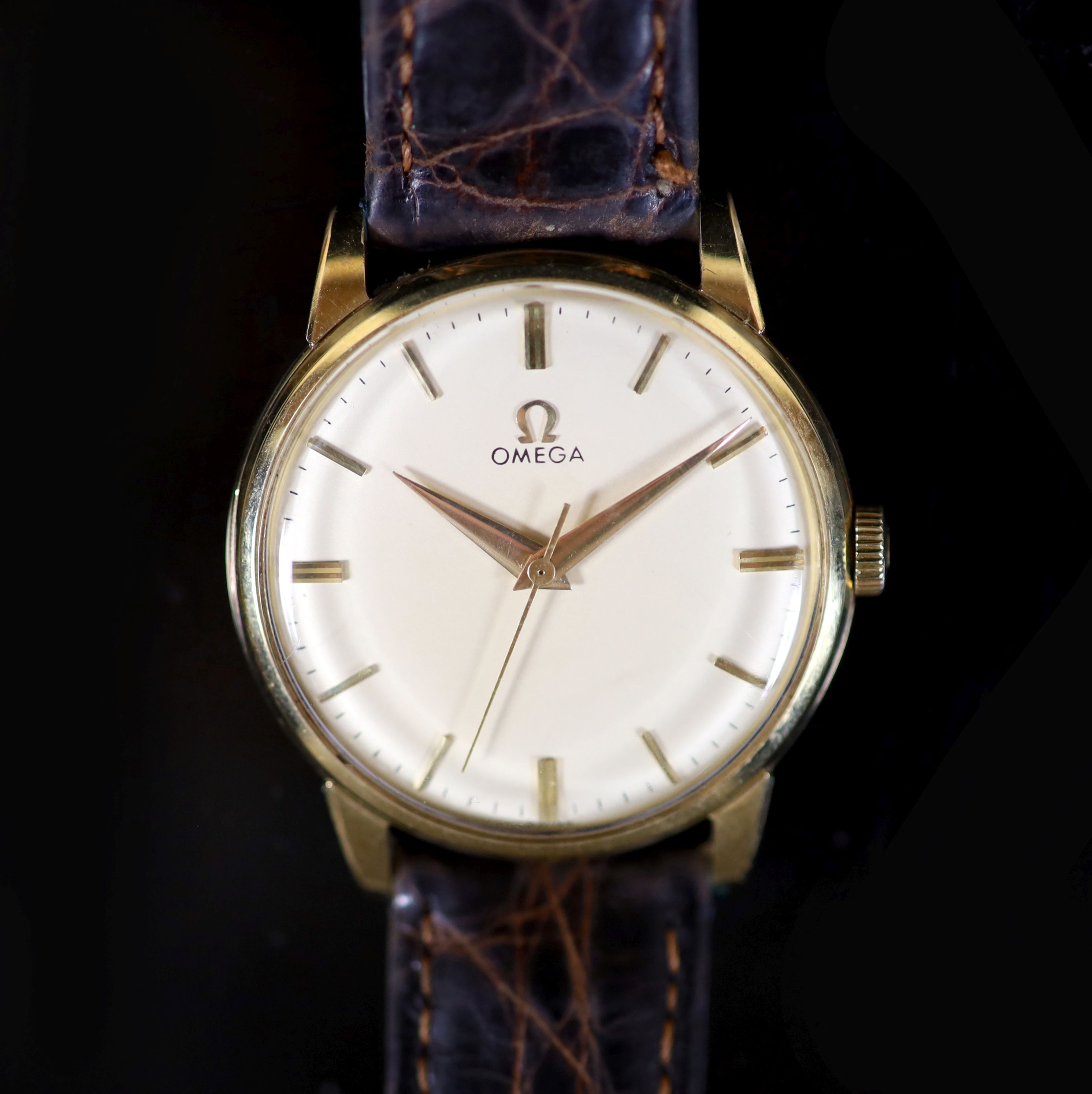 A gentleman's late 1950's 14ct gold Omega manual wind wrist watch,with baton numerals, movement c.