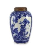 A large Chinese blue and white ovoid jar, 19th century,painted to shaped reserves with the ‘