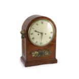 A George III mahogany bracket clock,the arched cased with foliate mount and lion's mask ring handles