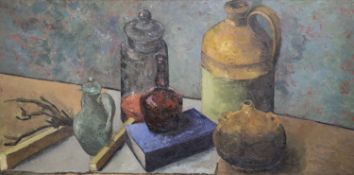 § Clarisse Loxton-Peacock (1926-2004) Still life of bottles, a book and flagon on a table topoil