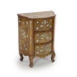 A mid 18th century North Italian marquetry inlaid walnut serpentine commode,decorated in bone with