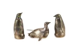 A modern textured silver novelty three piece condiment set, modelled as three penguins, two