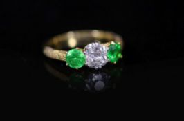 A Tiffany & Co gold, single stone diamond and two stone demantoid garnet set ring,with carved