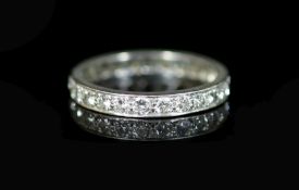 A platinum and diamond full eternity ring,set with twenty five round cut diamonds, size S, gross