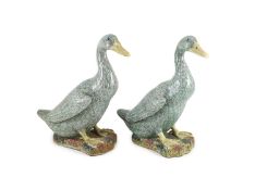 A pair of Chinese famille verte enamelled porcelain models of ducks, 19th century,each seated on