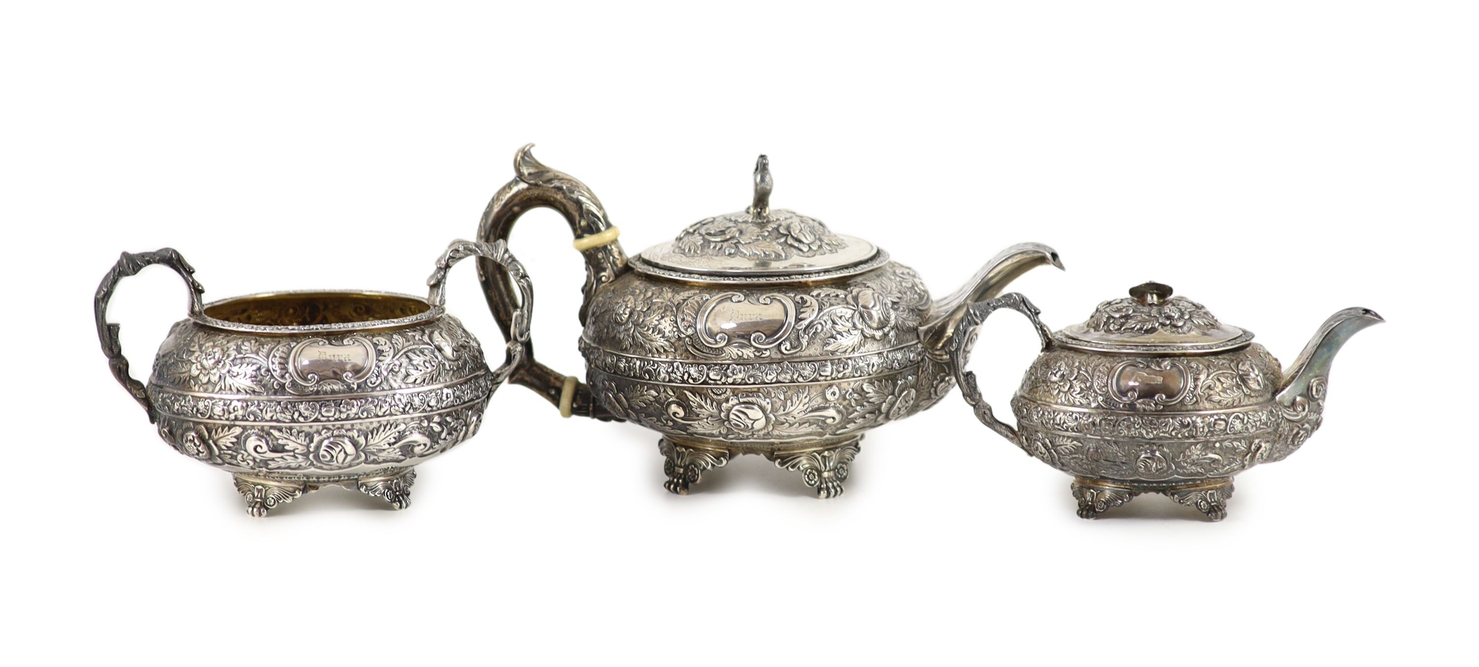 A late George III provincial silver three piece tea set by James Barber & William Whitwell,heavily