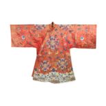 A Chinese apricot silk robe, mid 19th century,embroidered in polychrome silk and Beijing knot with