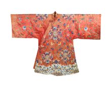 A Chinese apricot silk robe, mid 19th century,embroidered in polychrome silk and Beijing knot with
