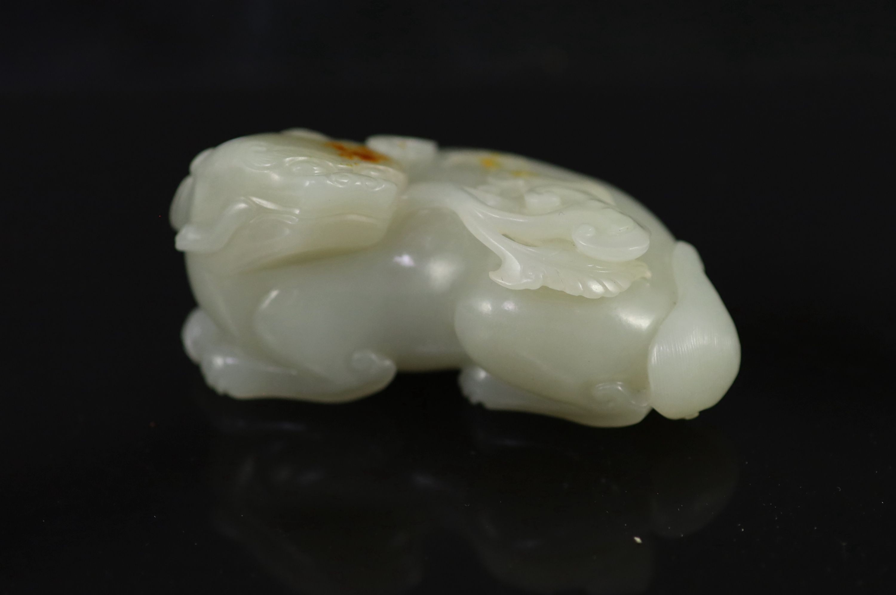 A Chinese pale celadon jade figure of a pixiu,biting a sprig of lingzhi fungus, the stone of good - Image 3 of 3