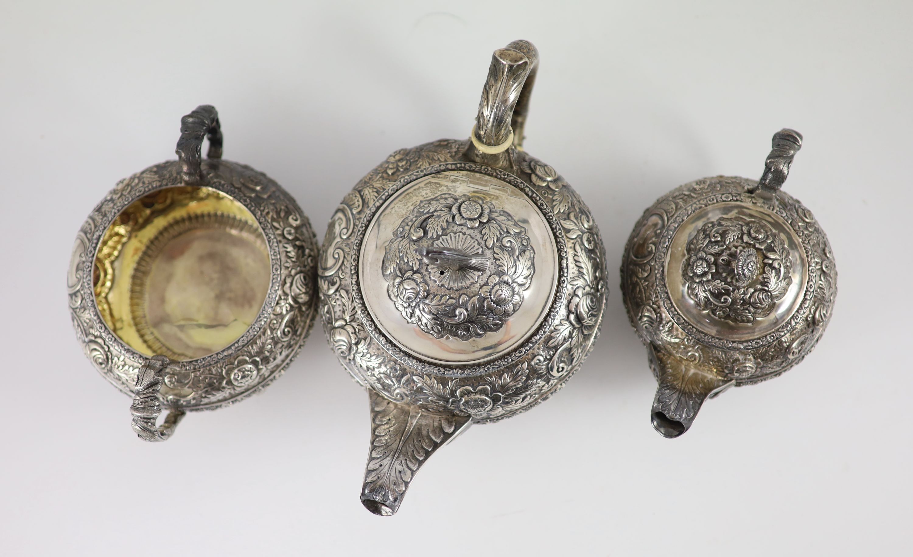 A late George III provincial silver three piece tea set by James Barber & William Whitwell,heavily - Image 3 of 4