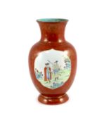 A Chinese coral ground ‘foreigners’ vase, Qianlong/Jiaqing period,painted in famille rose palette