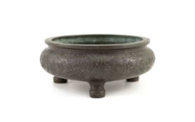 A Chinese bronze tripod censer, ding, 19th century,engraved and chased with dragons chasing a