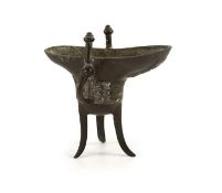 A Chinese archaistic bronze ritual tripod wine vessel, jue, Qianlong cyclical date mark and period,