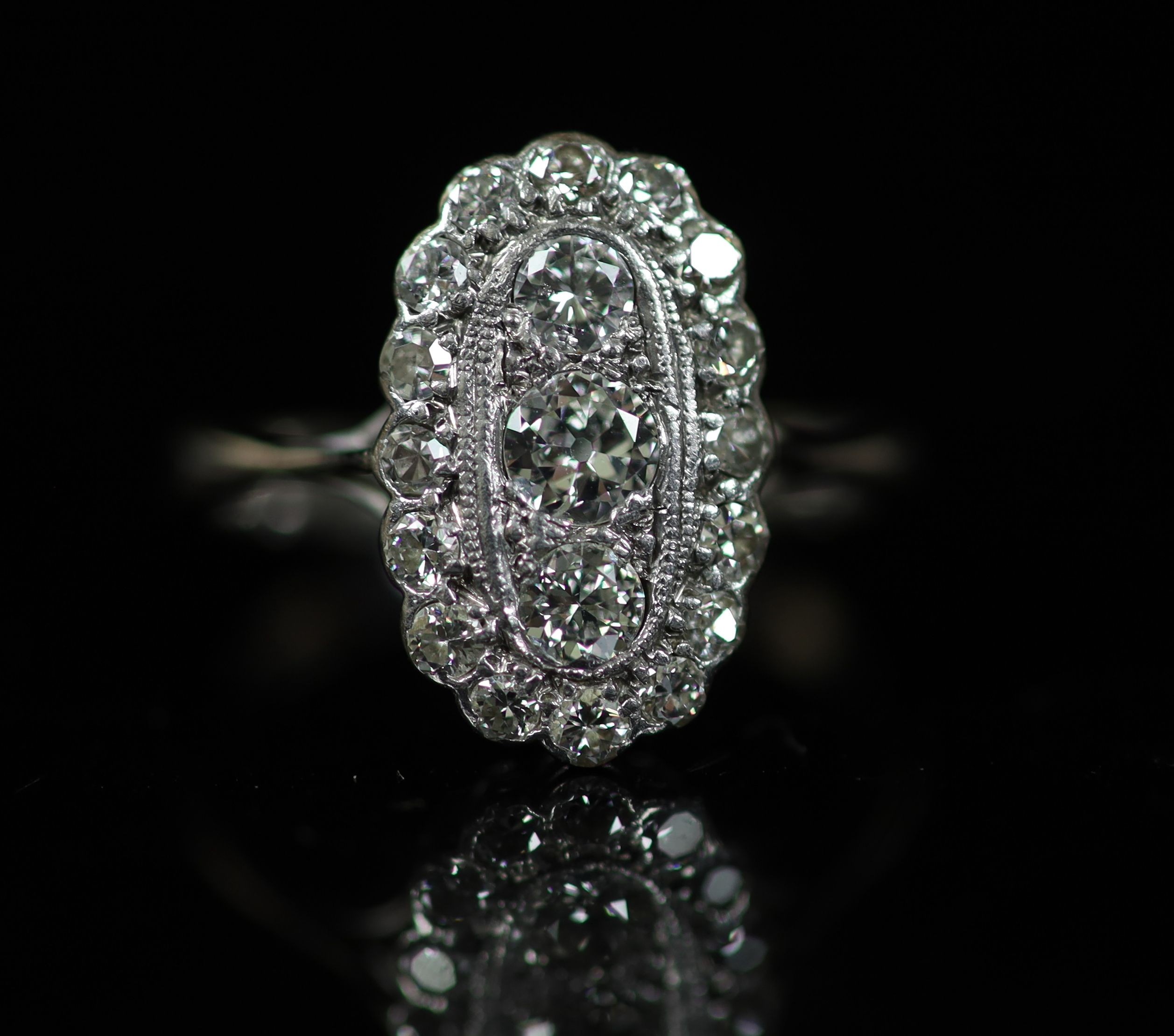 A 1940's 18ct white gold and diamond set oval cluster ring,size O/P, gross weight 3 grams. - Image 2 of 4