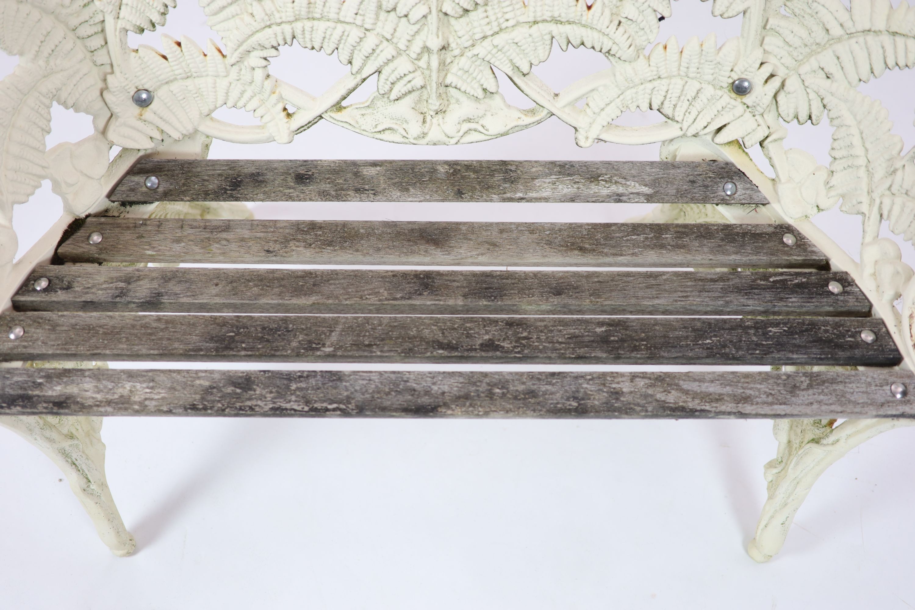 A Victorian cast iron Coalbrookdale 'Fern' pattern garden benchpainted white, with wooden slats to - Image 4 of 5