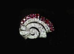 A mid 20th century white gold, ruby and diamond set fan shaped scroll brooch,set with graduated