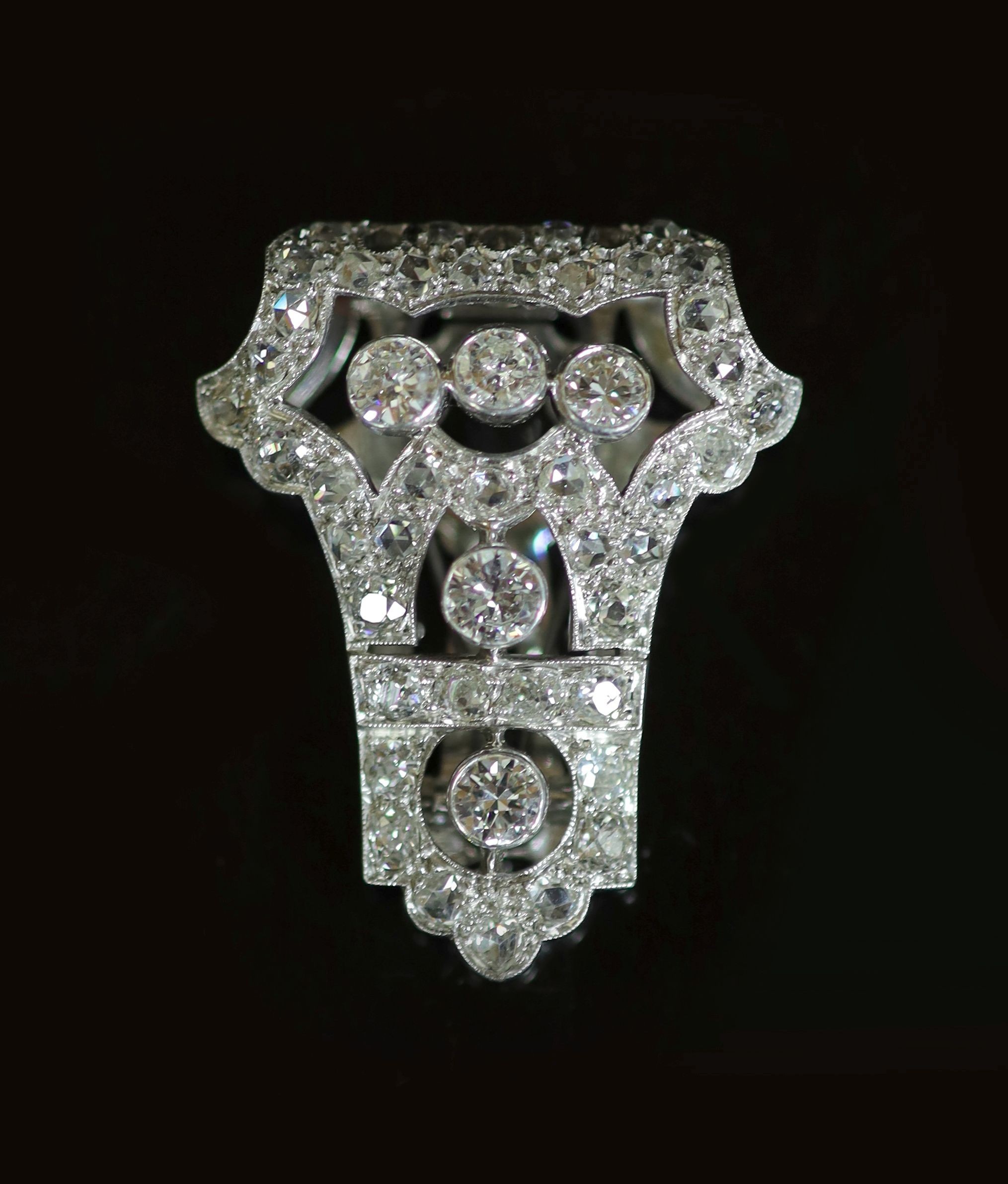 A 1920's/1930's Art Deco pierced platinum and diamond clip brooch,set with round and rose cut