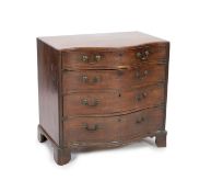 A George III mahogany caddy top serpentine chest,fitted four graduated long drawers flanked by