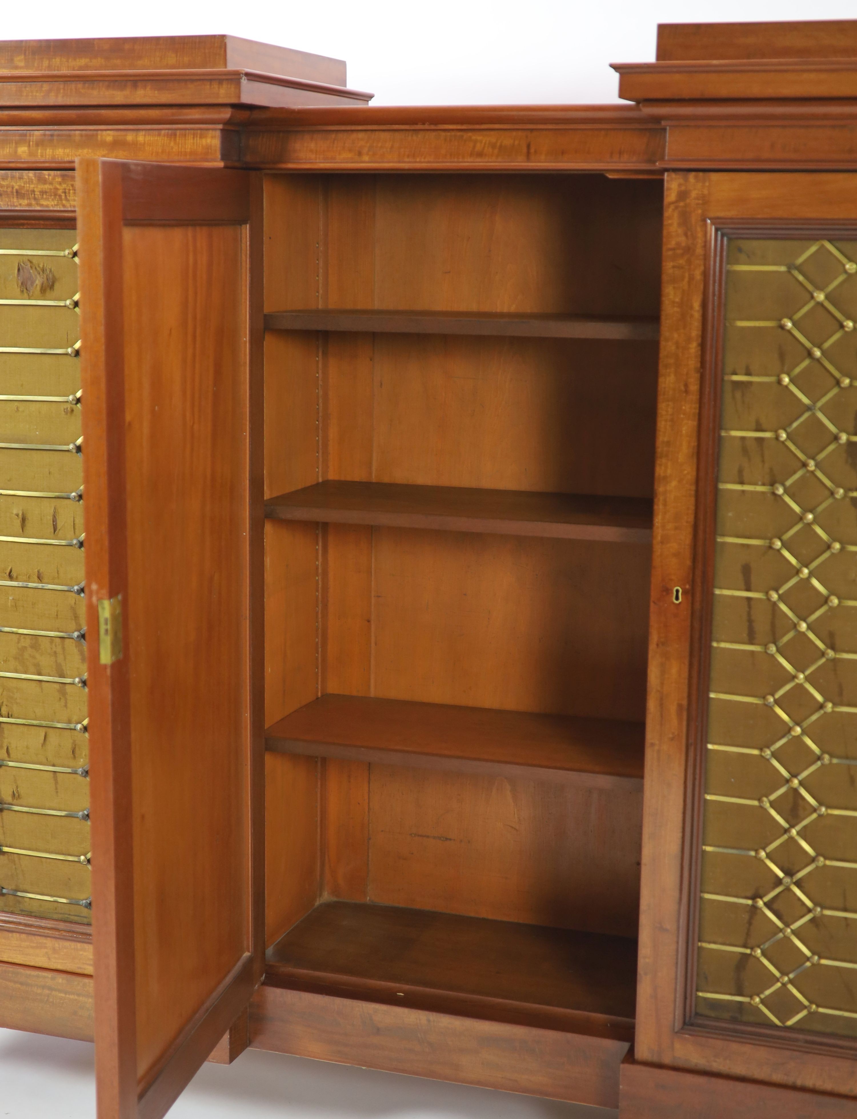 An early Victorian flame mahogany triple breakfront library cabinet,fitted five brass grilled - Image 2 of 4
