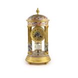 A late 19th century French ormolu and champleve enamel portico clock,the gilt arabic dial signed