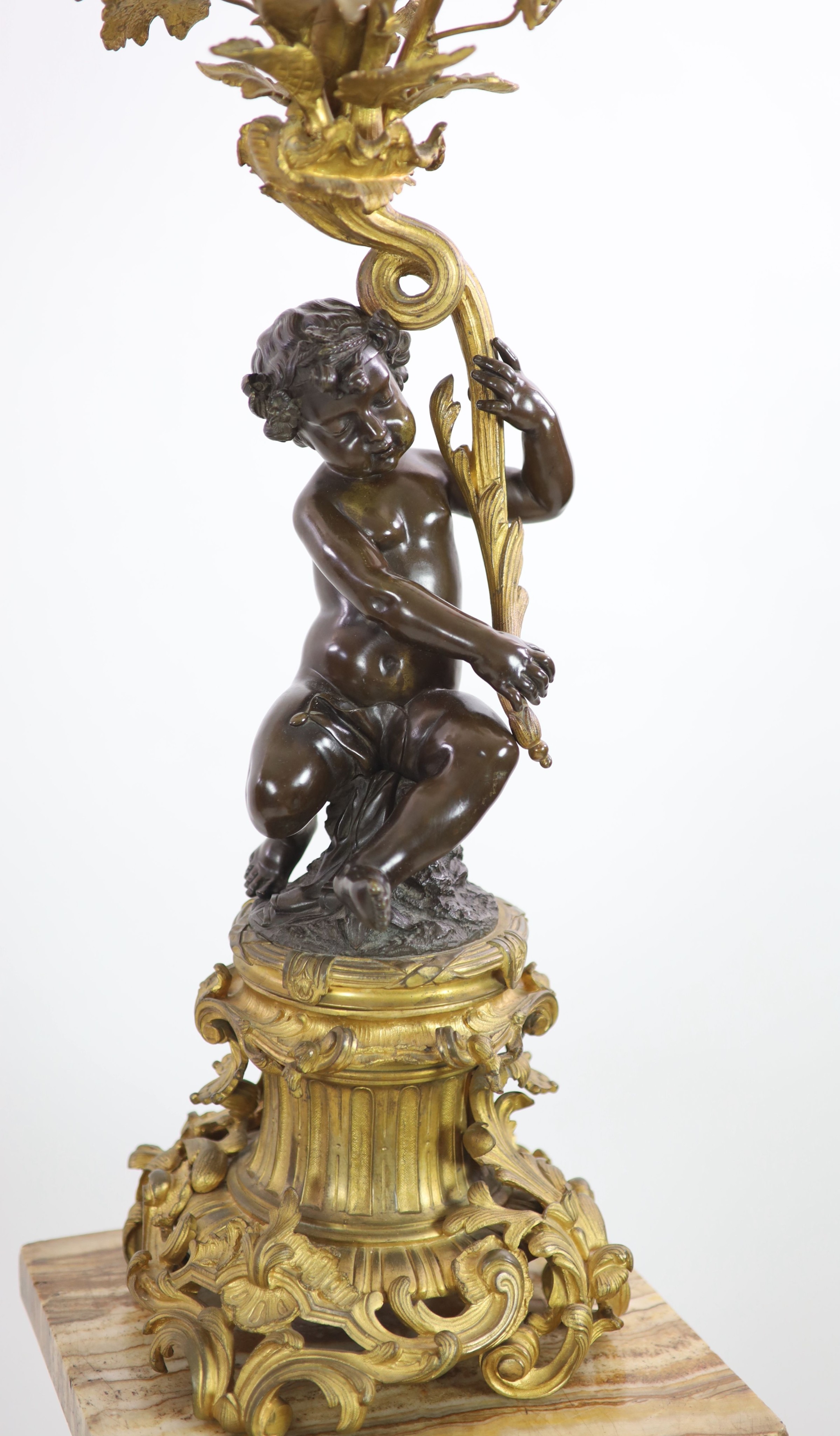 A pair of 19th century French bronze and ormolu six light candelabra,modelled as putti supporting - Image 3 of 6