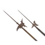 Two 18th century German halberds,one with engraved blade, the other smaller example plain,length