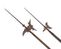 Two 18th century German halberds,one with engraved blade, the other smaller example plain,length