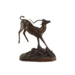 Tim Nicklin. A bronze model of a bucking impalarunning upon a naturalistic base, signed and dated