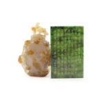 A Chinese agate vase and cover and a spinach green jade inscribed plaque, Qing dynasty and