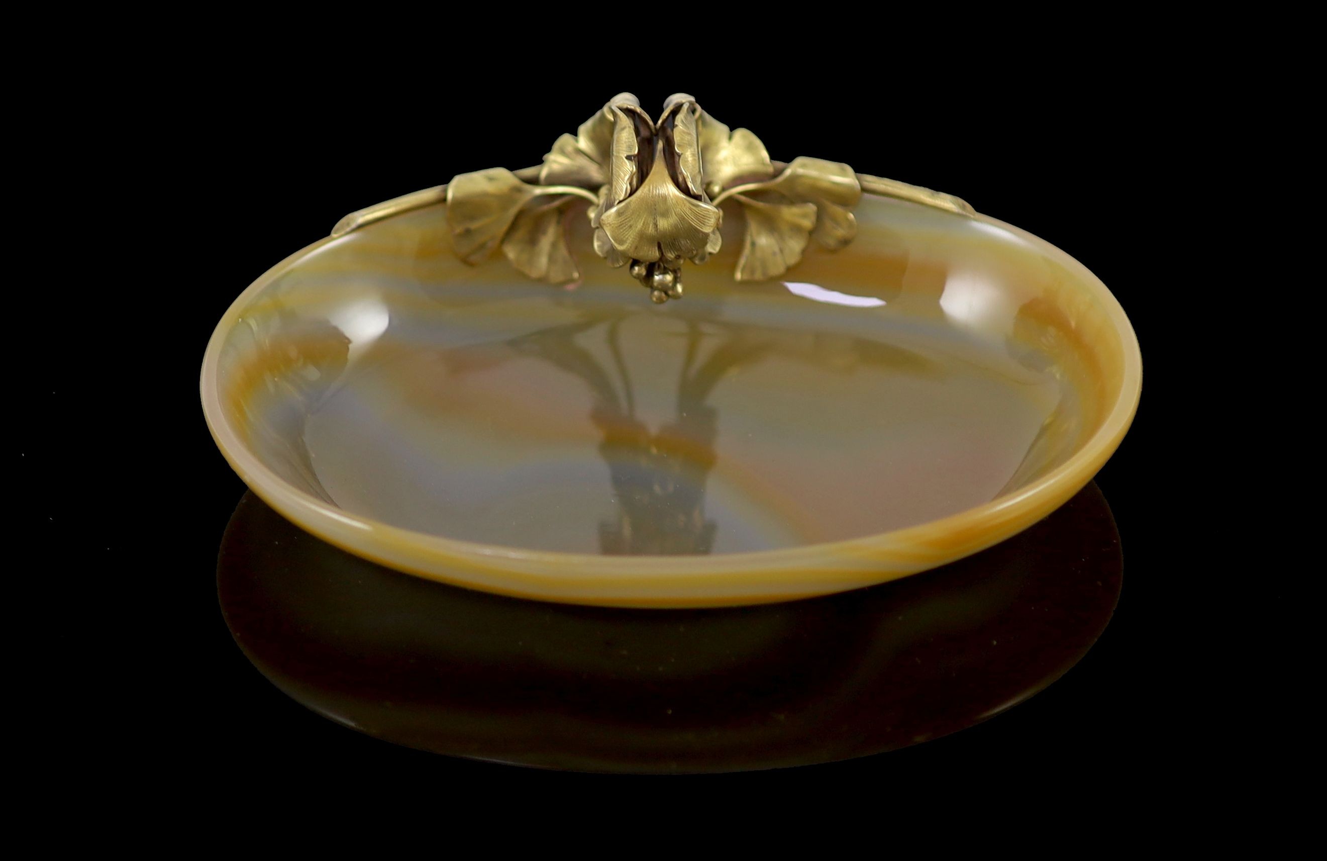 An early 20th century Boucheron silver gilt mounted banded agate oval bowl,the handle of foliate