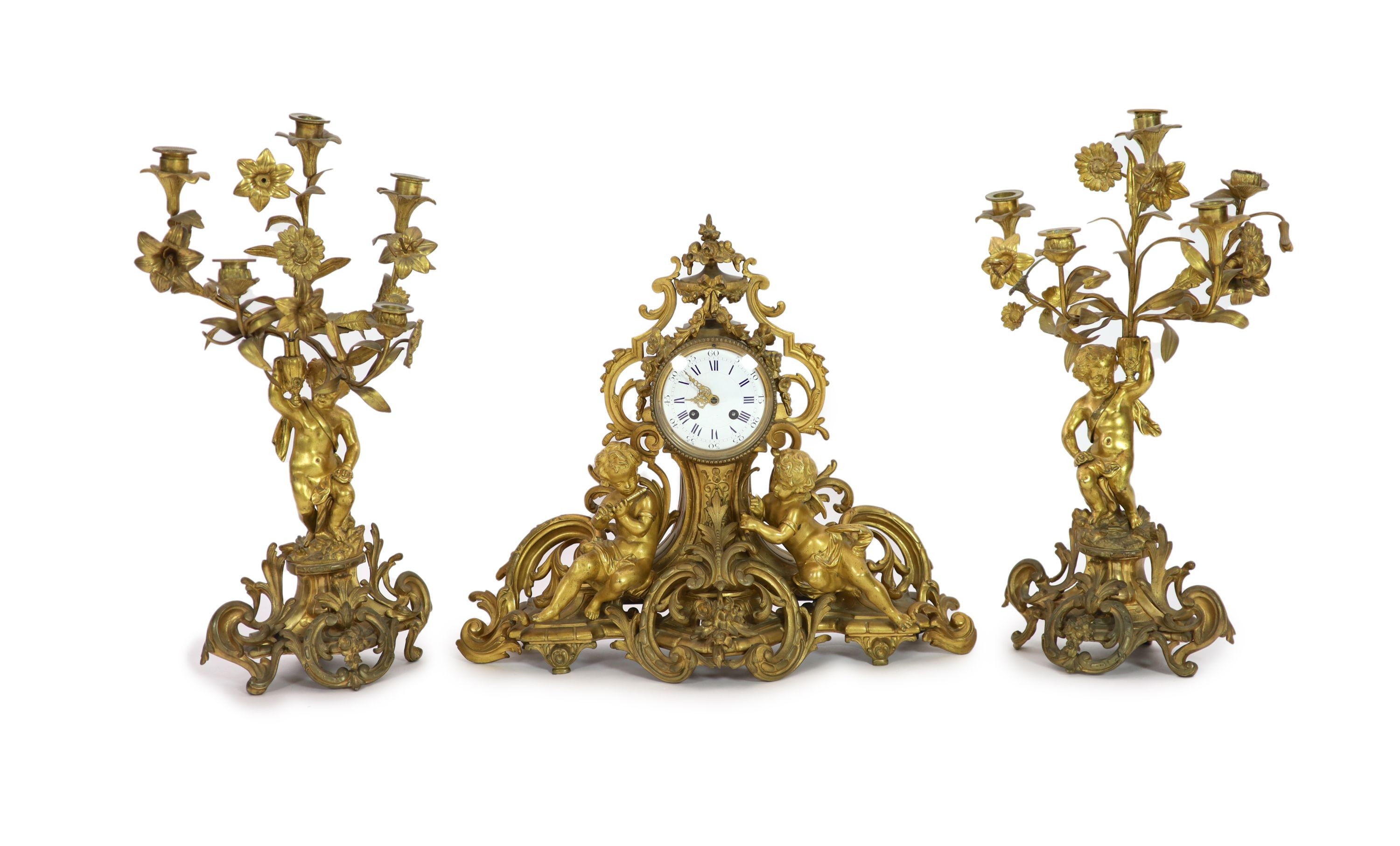 A 19th century Louis XV style ormolu clock garniture,the timepiece modelled with flowers and scrolls