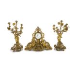 A 19th century Louis XV style ormolu clock garniture,the timepiece modelled with flowers and scrolls