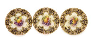 Three Royal Worcester fruit painted dessert plates, signed E. Phillips, c.1918,each within gilt-