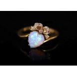 A late Victorian gold, heart shaped opal and diamond set crossover ring,with ribbon bow motif,