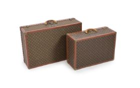 Two graduated Louis Vuitton Alzer suitcase trunks,both interiors labelled LOUIS VUITTON, AVE MARCEAU