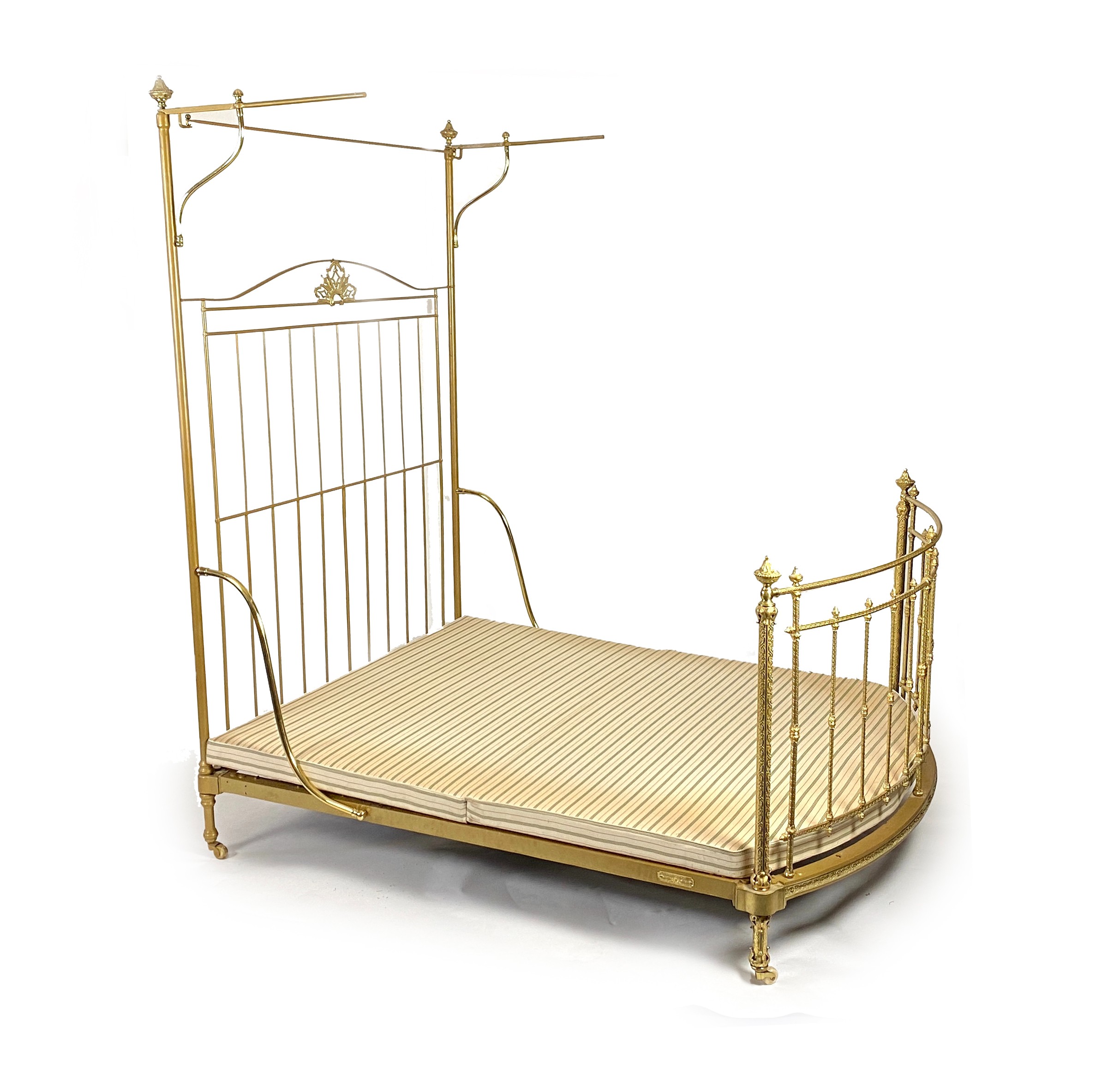 A Victorian R.W.Winfield & Co. brass half tester bed frame,With scroll embossed bow fronted foot