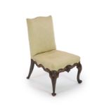 A George II red walnut side chairwith upholstered back and seat, with ornately carved scrolling