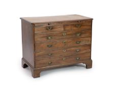 A George III mahogany chest,fitted brushing slide, two short and four graduated long drawers on