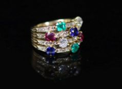 A gold, emerald, ruby, sapphire and diamond set quadruple shank dress ring,with diamond chip