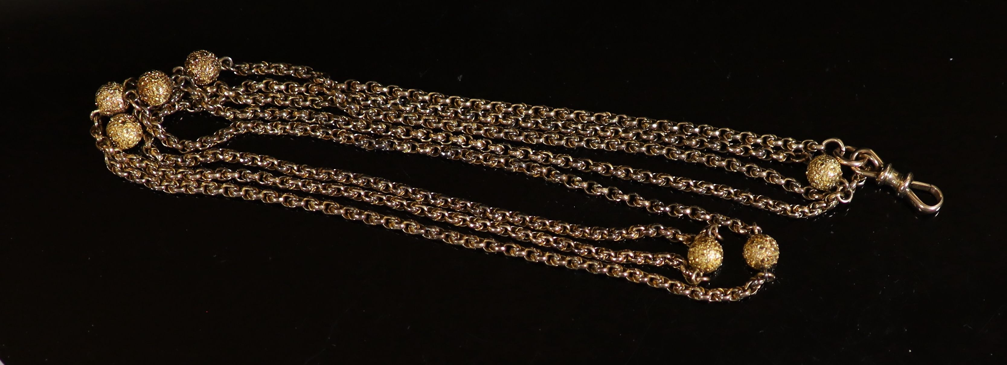 A 19th century 9ct gold guard chain with seven engraved spheres, 124cm,124cm, 27.2 grams. - Image 3 of 3