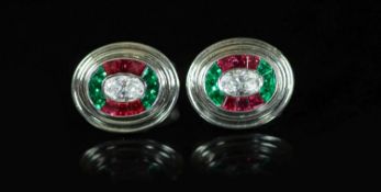 A pair of modern Asprey 18ct gold and platinum, ruby, emerald and diamond oval cufflinks,the central