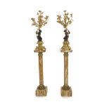 A pair of 19th century French bronze and ormolu six light candelabra,modelled as putti supporting