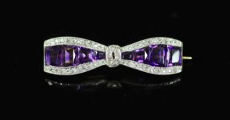 A 20th century gold and platinum, amethyst and millegrain diamond set 'bow tie' brooch,set with