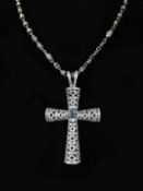 A Theo Fennell white gold, oval cut aquamarine and diamond chip cluster set pierced cross pendant,