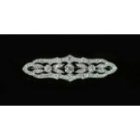 A mid 20th century pierced platinum and diamond cluster set brooch,of shaped oval form, 52mm,