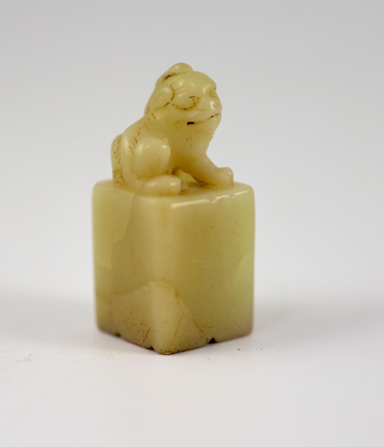 A Chinese inscribed cream coloured soapstone seal,of square section, surmounted by the figure of a - Image 4 of 4