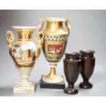 Two 19th century Paris porcelain gilt decorated swan-handled vases and a pair of turned ebony vases,